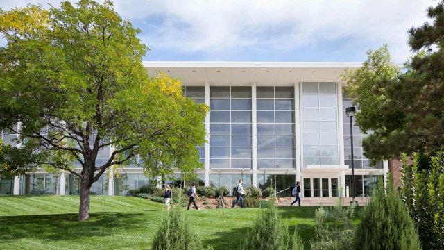 students walking outside of Dwire Hall