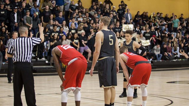 UCCS basketball player getting ready to make a free throw