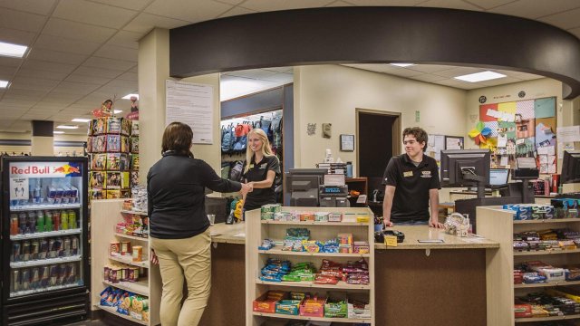 student workers on the job at the bookstore