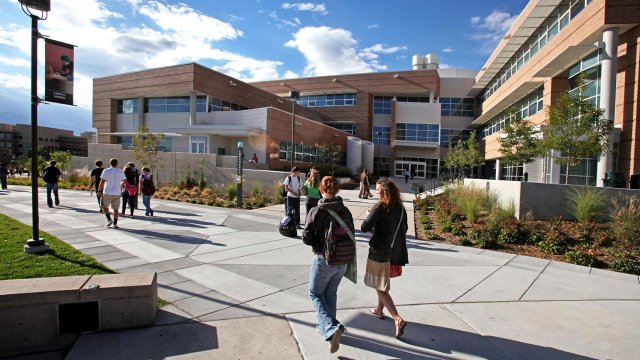 students walking to class with Osborne in the background