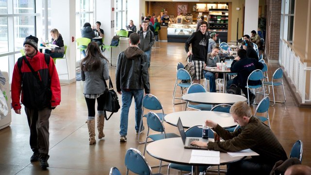 students walking through the Upper University Center