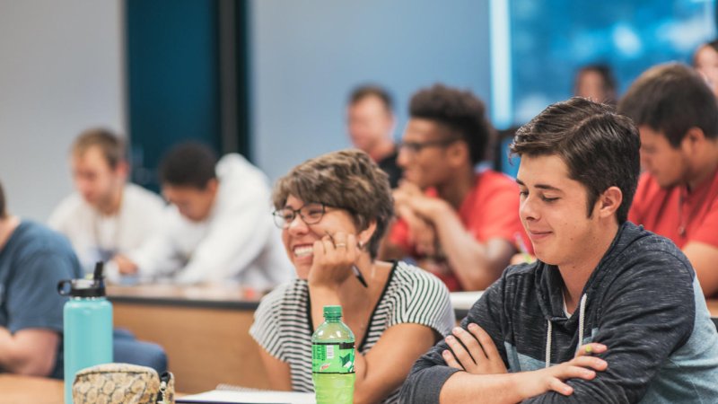 student smiling in class