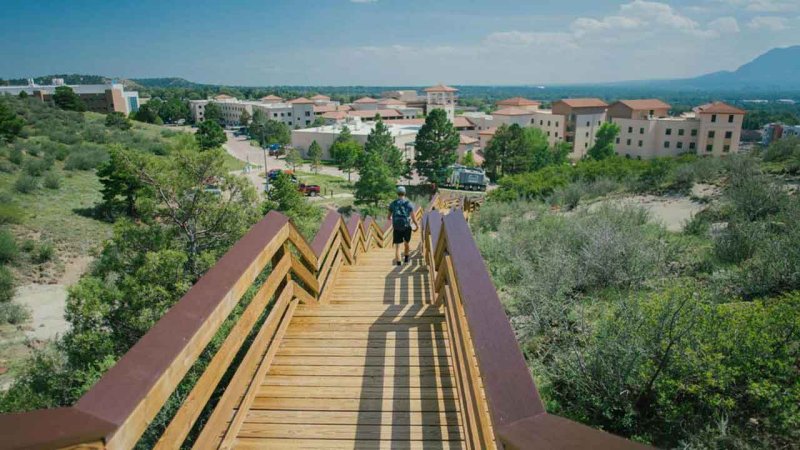 student walking along Teva Trail