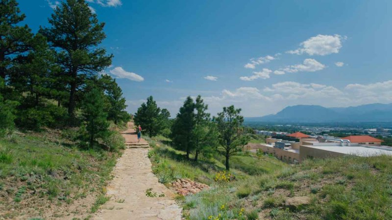 student hiking along Teva Trail