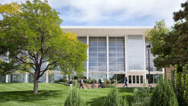students walking outside of Dwire Hall