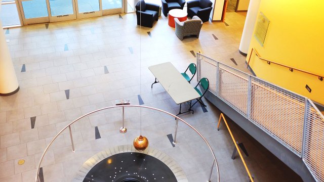 pendulum sculpture inside the Osborne building